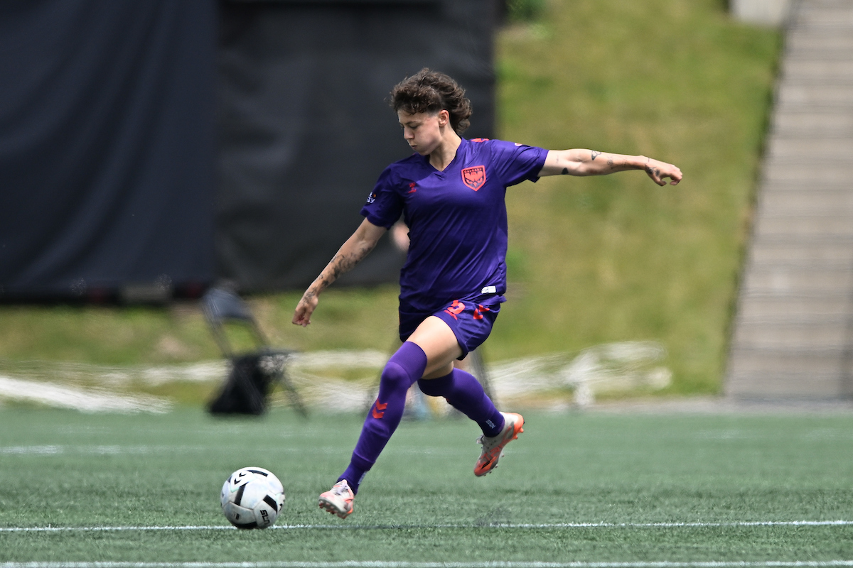 Meikayla Moore kicks the ball during a match